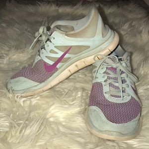 Blue and purple Nike running shoes